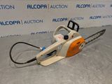 a close up of a chainsaw sitting on top of a table
