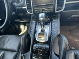 a close up of a car dashboard with a steering control