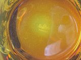 a close up of a glass with a liquid inside of it