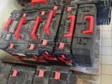 several black and red batteries stacked on top of each other