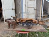 a wooden cart with a horse and a cart of logs