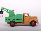 a toy truck with a crane attached to it ' s back