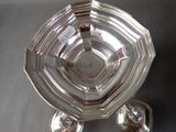 a silver plate with a turtle on it on a table