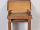 a small wooden desk with a drawer on it