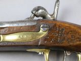 a close up of a gun that is on a table
