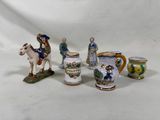 un ensemble de figurines représentant des personnes à cheval et des chevaux