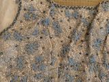 a picture of a dress with sequins and bows on it