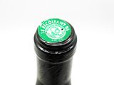 a close up of a bottle of wine with a green label
