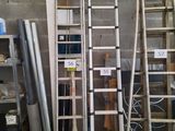 many ladders that are stacked up in a room