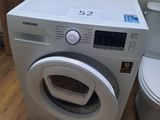 a washer and a toilet in a small room