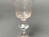 a glass cup that is sitting on a table
