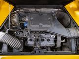 a close up of the engine of a yellow car