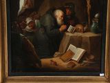 painting of an old man reading a book in front of a skull