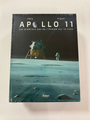 a book with an image of an astronaut on the moon