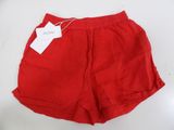 a red shorts with a tag on the side of it