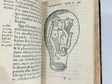 an open book with a drawing of a light bulb inside of it