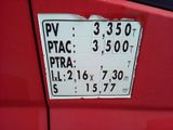 a sign on the side of a red car that says piac pira