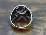 sterling silver ring with garnetite and diamonds