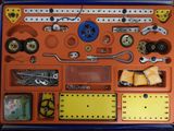 an orange box with a bunch of different items in it