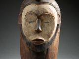 an image of a wooden sculpture of a man with a beard