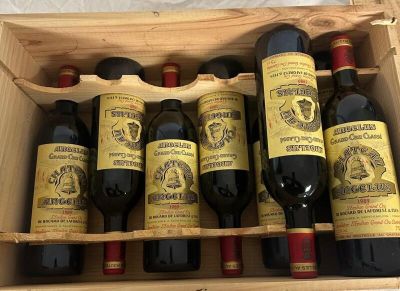 six bottles of wine in a wooden box