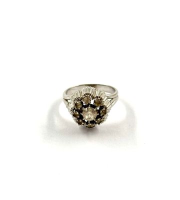 an image of a silver ring with a flower design on it