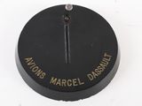 a close up of a black object with a gold inscription on it