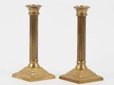 pair of antique brass candlesticks with fluted bases