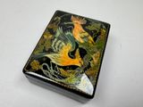 a small box with a bird on it on a table