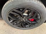the tire of a car with a flat tire on the ground