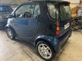 a small car that is parked in a garage