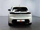 the rear end of a white car in a white room