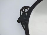 a horse head hanging on the side of a mirror