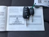 a car key and a receipt sitting on a table