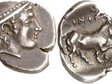 a close up of a coin with a head of a woman on it