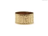 a close up of a gold ring on a white background