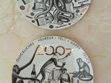 two plates with different designs on them on a table