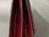 a red purse that is sitting on a table