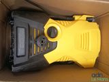 a yellow and black pressurer in a box with a black handle