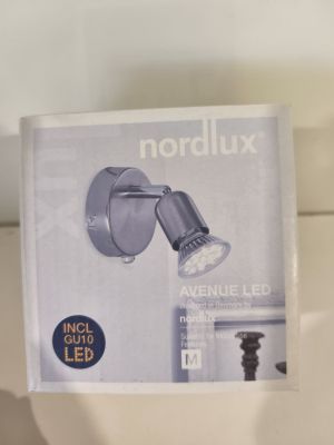 a picture of a bathroom light that is on the wall