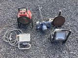 three different types of flood lights on the ground