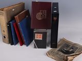several old books are stacked on top of each other on a table