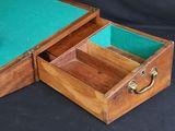 a small wooden box with two open compartments