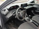 the interior of a car with a steering wheel and dashboard controls