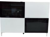 a black and white cabinet with a mirror on top of it
