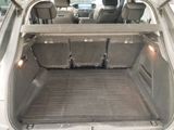 a trunk of a car with the back seats folded down