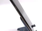 a close up of a cell phone on a stand