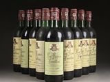 several bottles of wine are lined up in a row