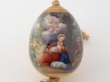 an egg with a picture of a woman and a child on it