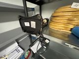 a large stack of bread on a shelf in a kitchen